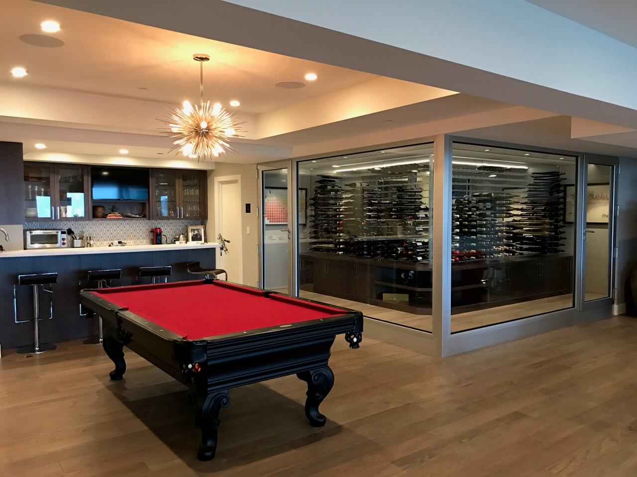 Gameroom, bar, and chilled wine room